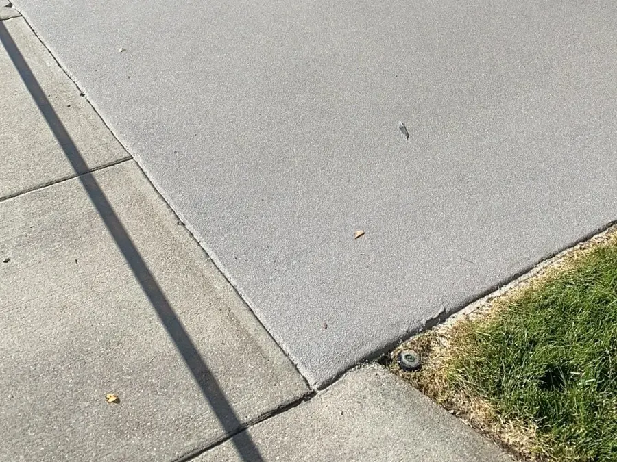 Smooth, evenly cleaned concrete driveway surface