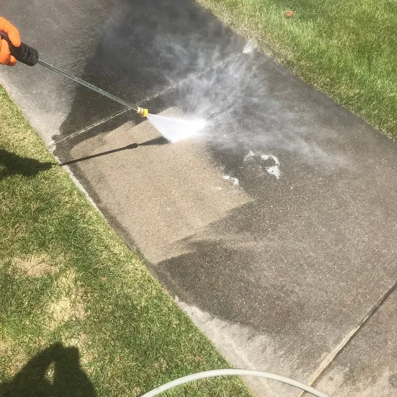 Walkway halfway through cleaning, showing before and after